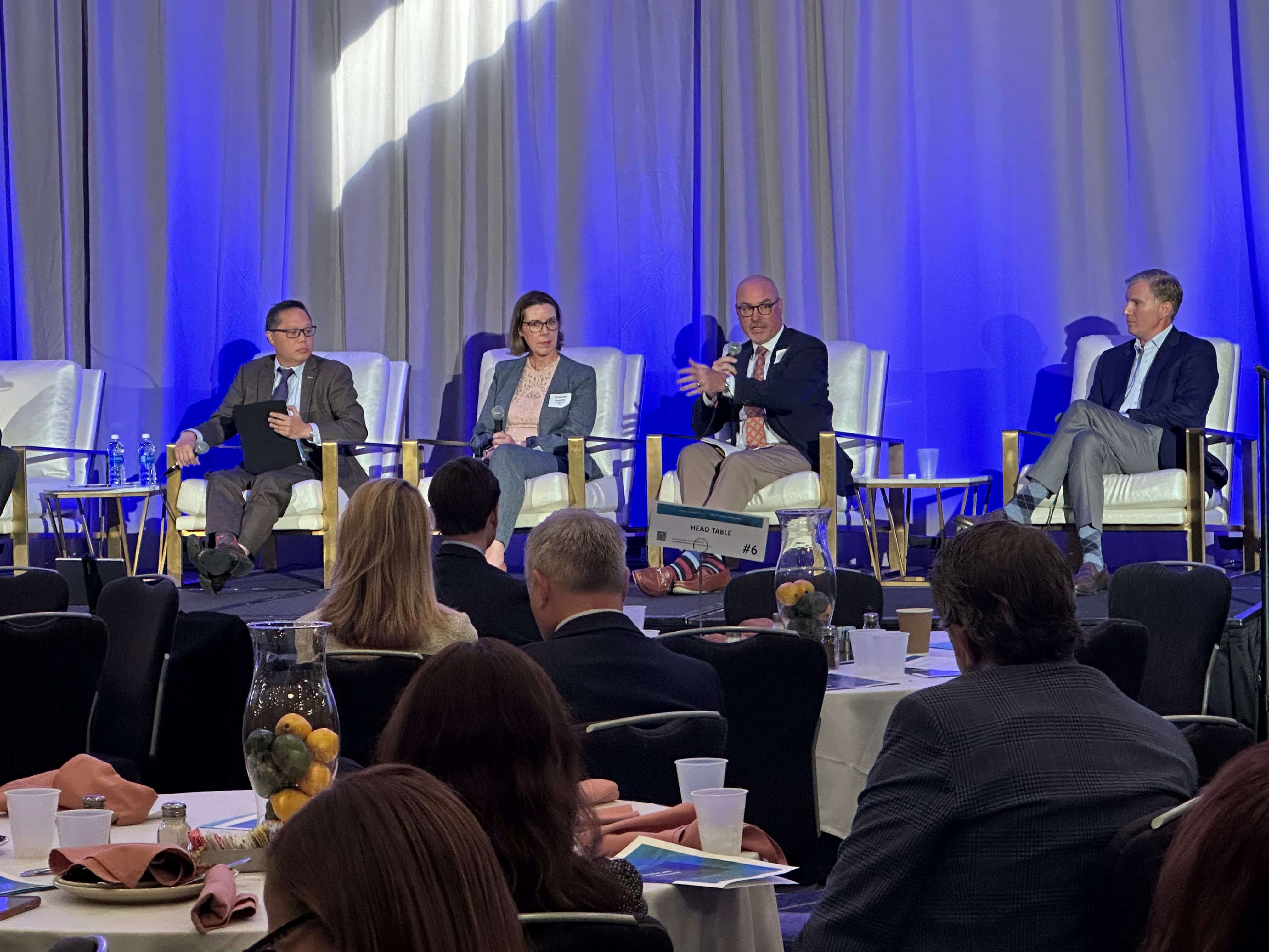 Brian Floyd, chief operating officer of ECU Health and president of ECU Health Medical Center, second from right, speaks during a health care conference in Durham. He is joined on the panel by, from left, Dr. Art Apolinario, board president of the N.C. Medical Society, Jennifer Sacks, associate director of the clinical operations program lead for Biogen, and Dr. Creagh Milford, senior vice president of retail health for CVS Health.