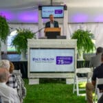 ECU Health CEO Dr. Michael Waldrum speaks to ECU Health team members and community members at ECU Health Roanoke-Chowan Hospital's 75th anniversary celebration.