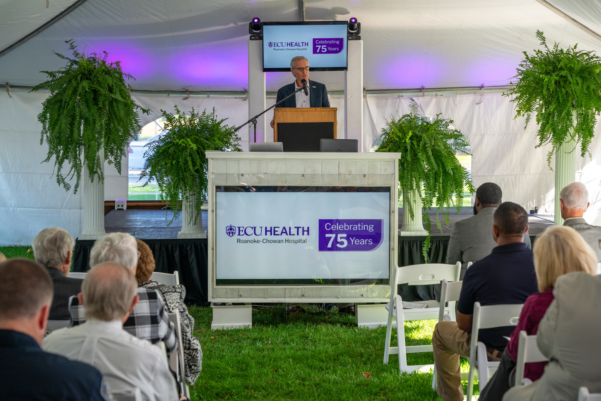 ECU Health CEO Dr. Michael Waldrum speaks to ECU Health team members and community members at ECU Health Roanoke-Chowan Hospital's 75th anniversary celebration.