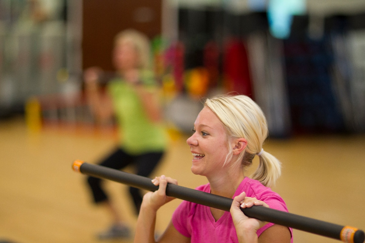 A woman participates in an exercise class at an ECU Health Wellness Center.