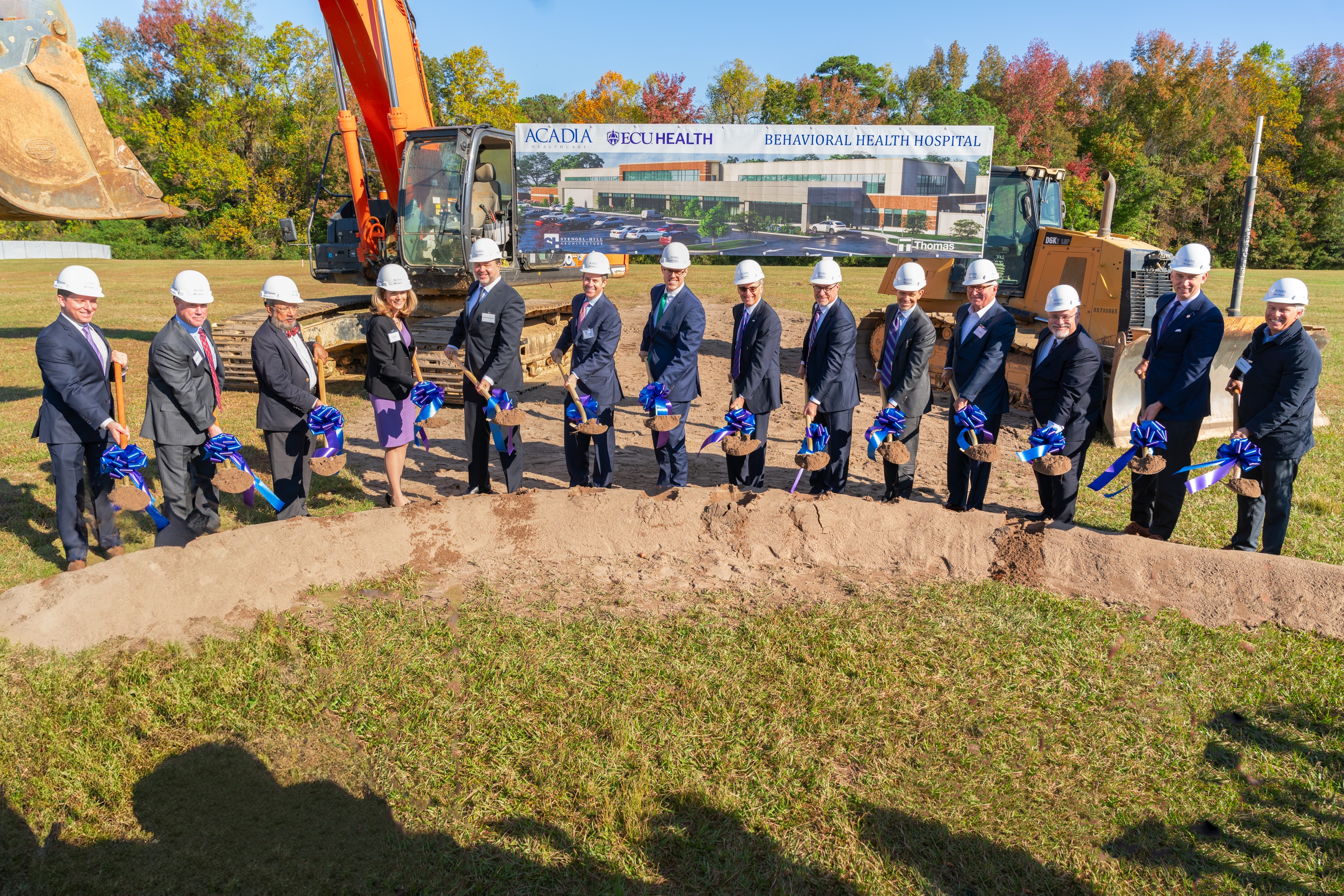 Groundbreaking 1 From left: Brennen Reynolds, Jeffrey Woods, Dr. Sy Saeed, Isa Diaz, Dr. Michael Genovese, Chris Hunter, Sec. Kody H. Kinsley, Dr. Michael Waldrum, Brian Floyd, Todd Hickey, Bob Greczyn, Dr. Michael Lang, Chancellor Philip Rogers, William Monk hold shovels during the groundbreaking for the upcoming behavioral health hospital in Greenville.