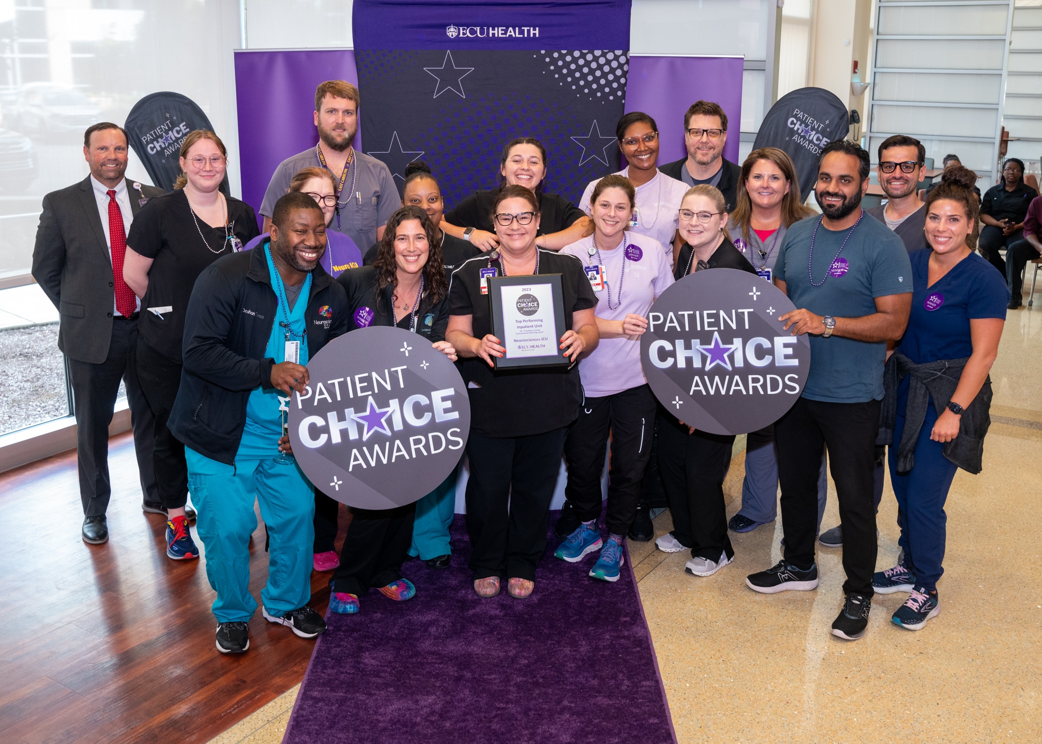 The ECU Health Medical Center Neurosciences ICU team gathers for a group photo to celebrate their Patient Choice Award.