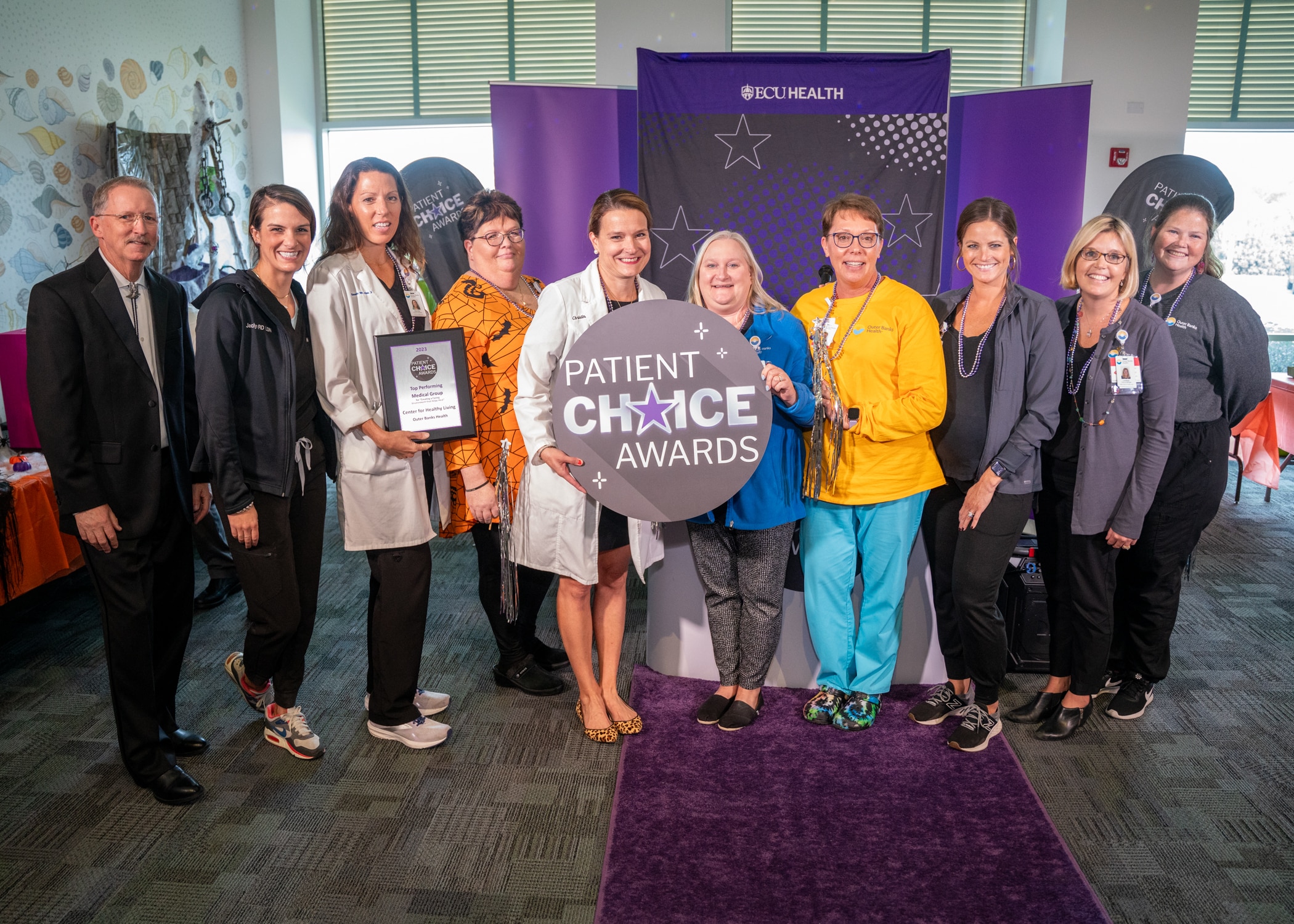The Outer Banks Health Center for Healthy Living team gathers for a group photo to celebrate earning a Patient Choice Award.