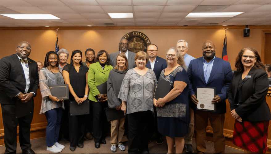 The 2023 Governor’s Volunteer Service Award winners were recognized by the Pitt County Board of Commissioners during a recent meeting. The award winners are shown in a Pitt County government meeting room, posing for a photo.