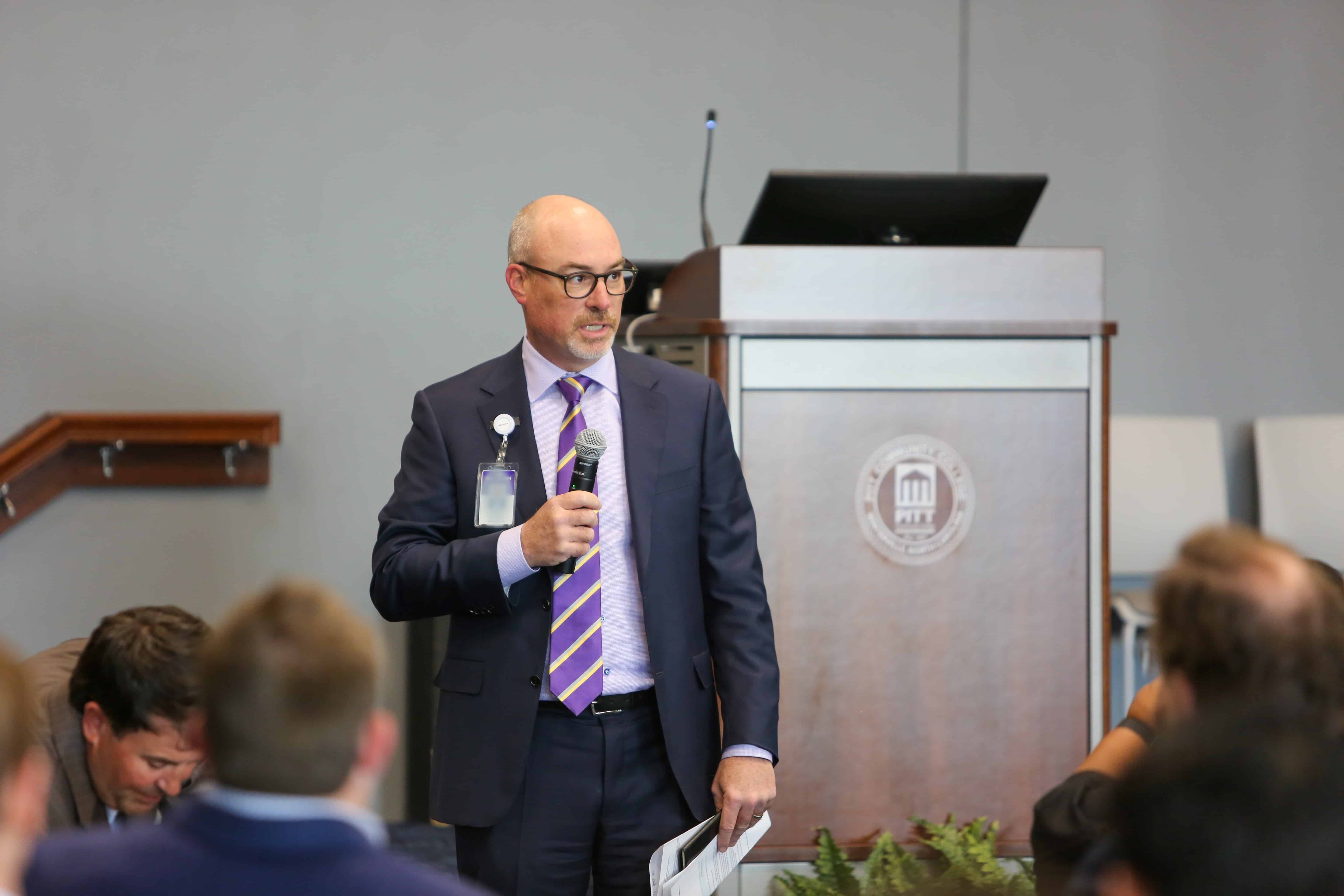 Brian F. NCHA Advocacy Brian Floyd, COO at ECU Health, speaks to a group of lawmakers and health care leaders during an NCHA Meet and Greet event at Pitt Community College.