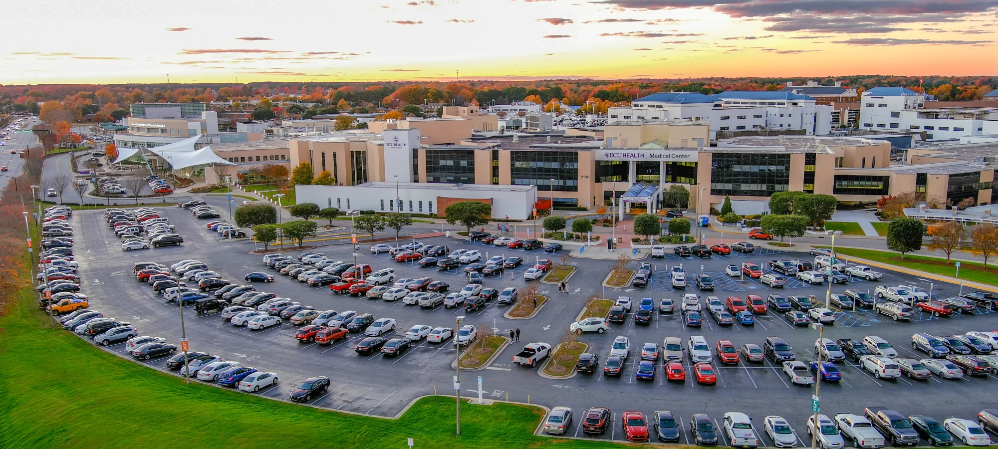 Drone footage shows ECU Health Medical Center in Greenville at sunset.