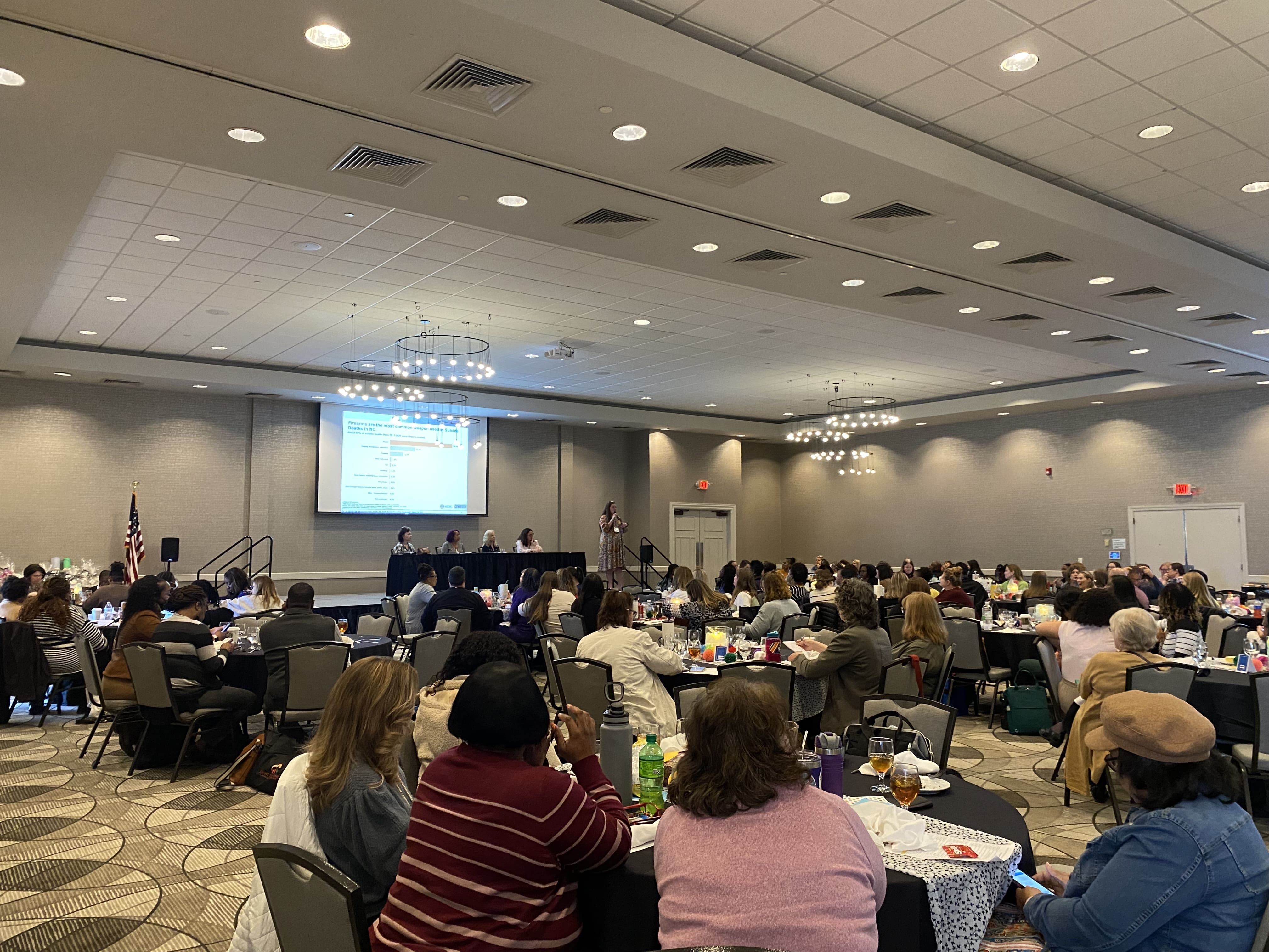 Attendees listen to a presenter during a youth mental health conference for professionals across the state, hosted by ECU Health and NCDHHS.