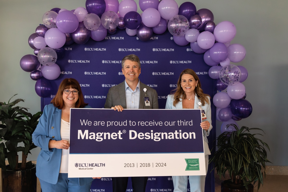 Trish Baise poses for a photo with Jay Briley and Stephanie Seburn during the Magnet Designation celebration.