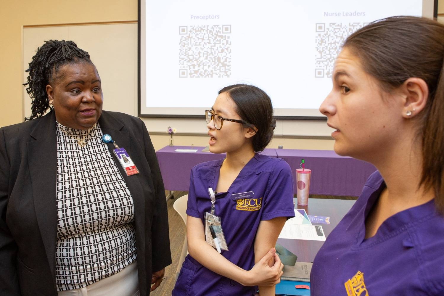 ECU Health nurse extern graduation July 2024 5 (1) Attendees talk following the ECU Health nurse extern graduation in July of 2024.