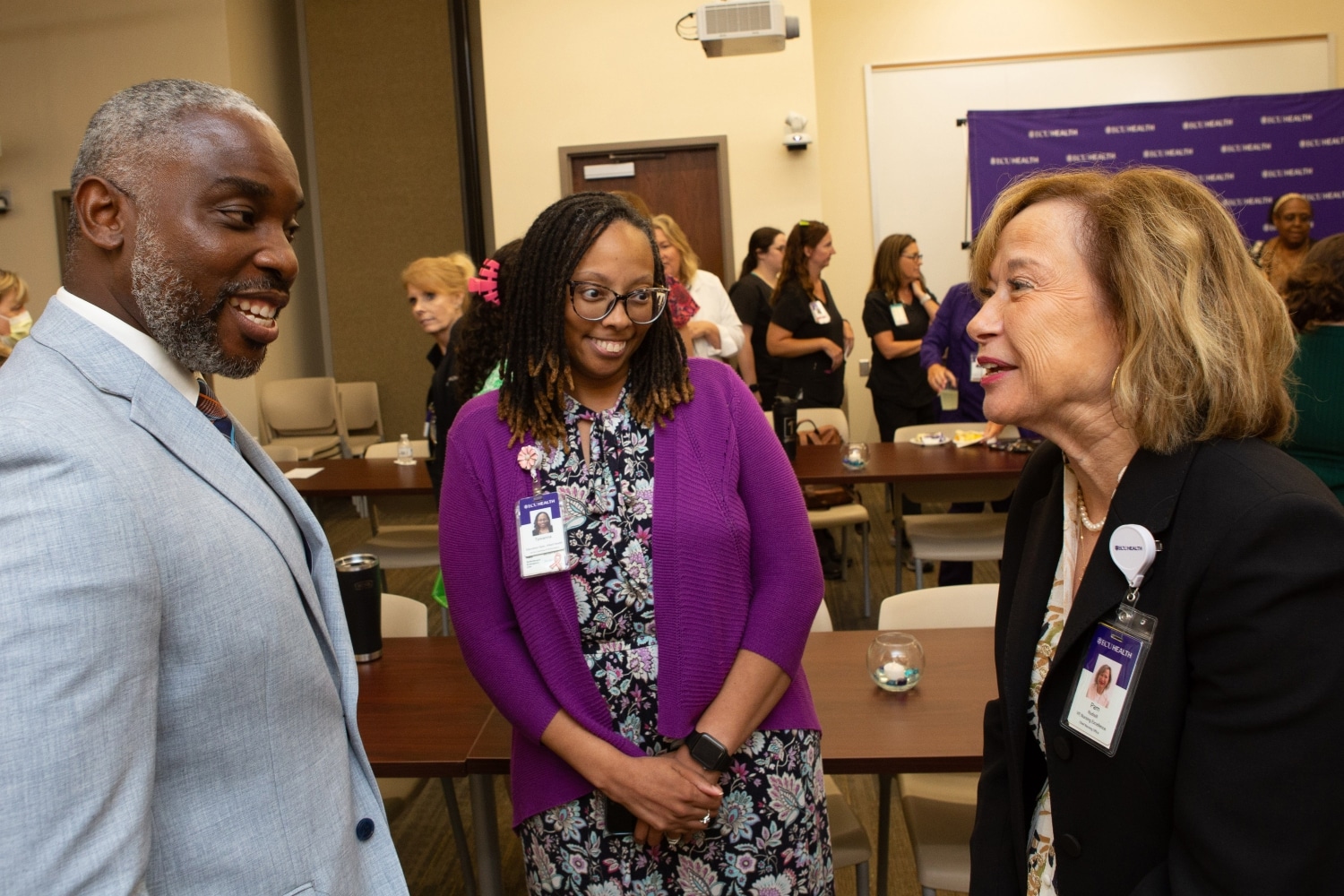 ECU Health nurse extern graduation July 2024 8 (1) Dr. Bim Akintade, dean of the College of Nursing, and Dr. Pam Rudisill, ECU Health’s vice president of nursing excellence, talk together.