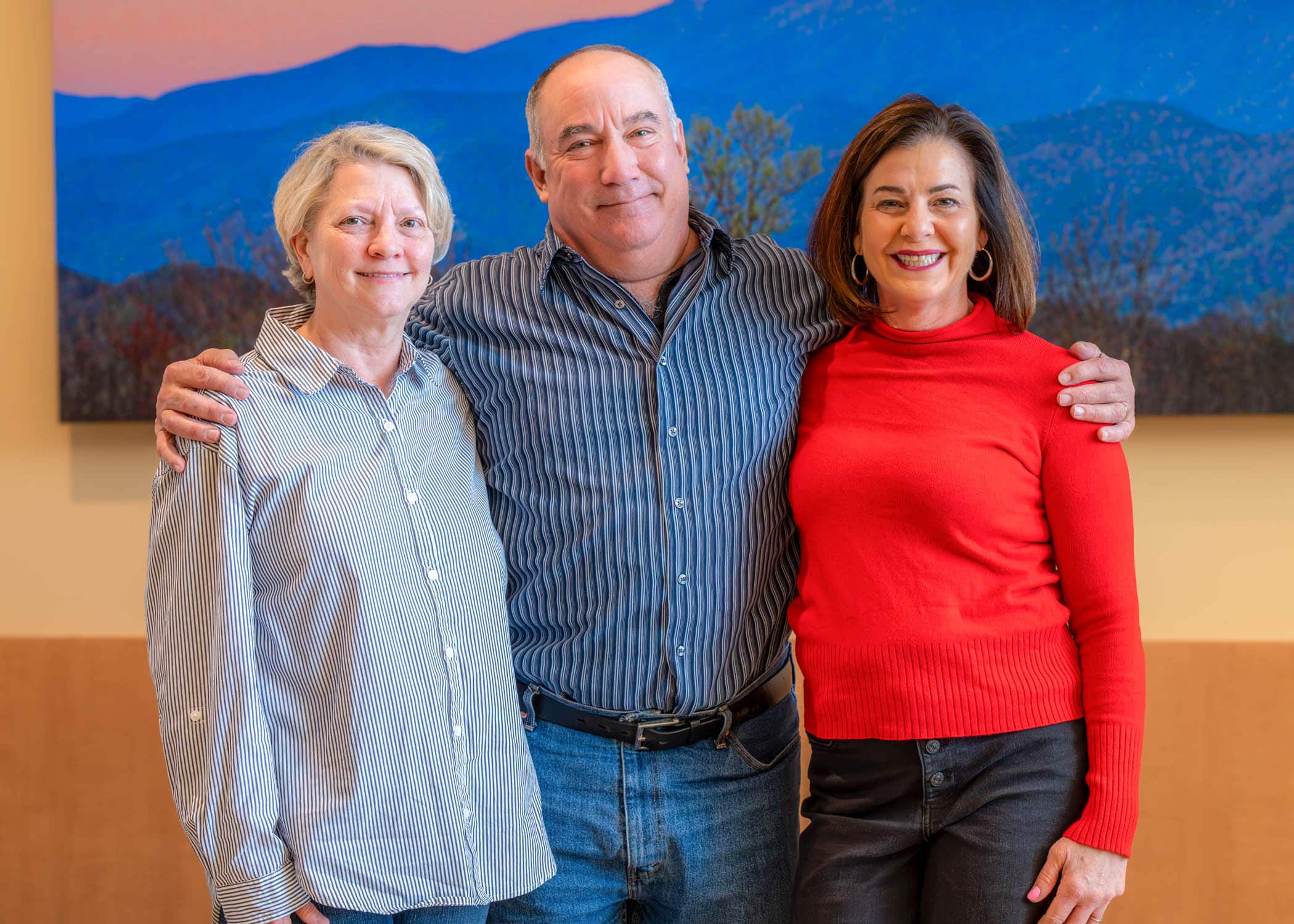 TonyDeliaParker-0758-Edit Tony Parker, center, stands with his wife, Delia, left, and ECU Health team member Vicky Greco, right.