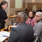 Dr. Niti Armistead talks with colleagues during the 9th annual ECU Health Quality Improvement Symposium.