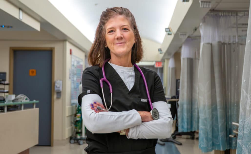 Rebecca Zelnar stands in the hall on her unit.