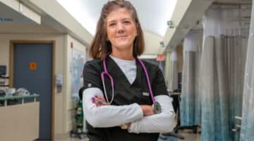 Rebecca Zelnar stands in the hall on her unit.