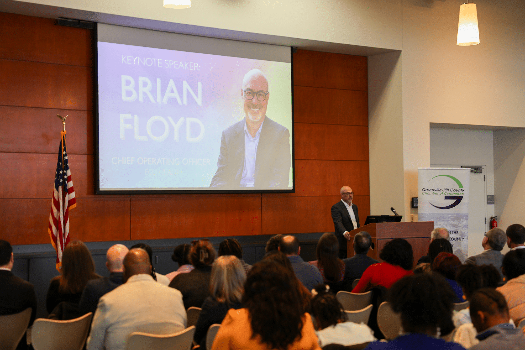 Community Unity Breakfast 3 Brian Floyd, COO of ECU Health, speaks to community members at the Greenville-Pitt County Chamber of Commerce's annual Community Unity Breakfast.