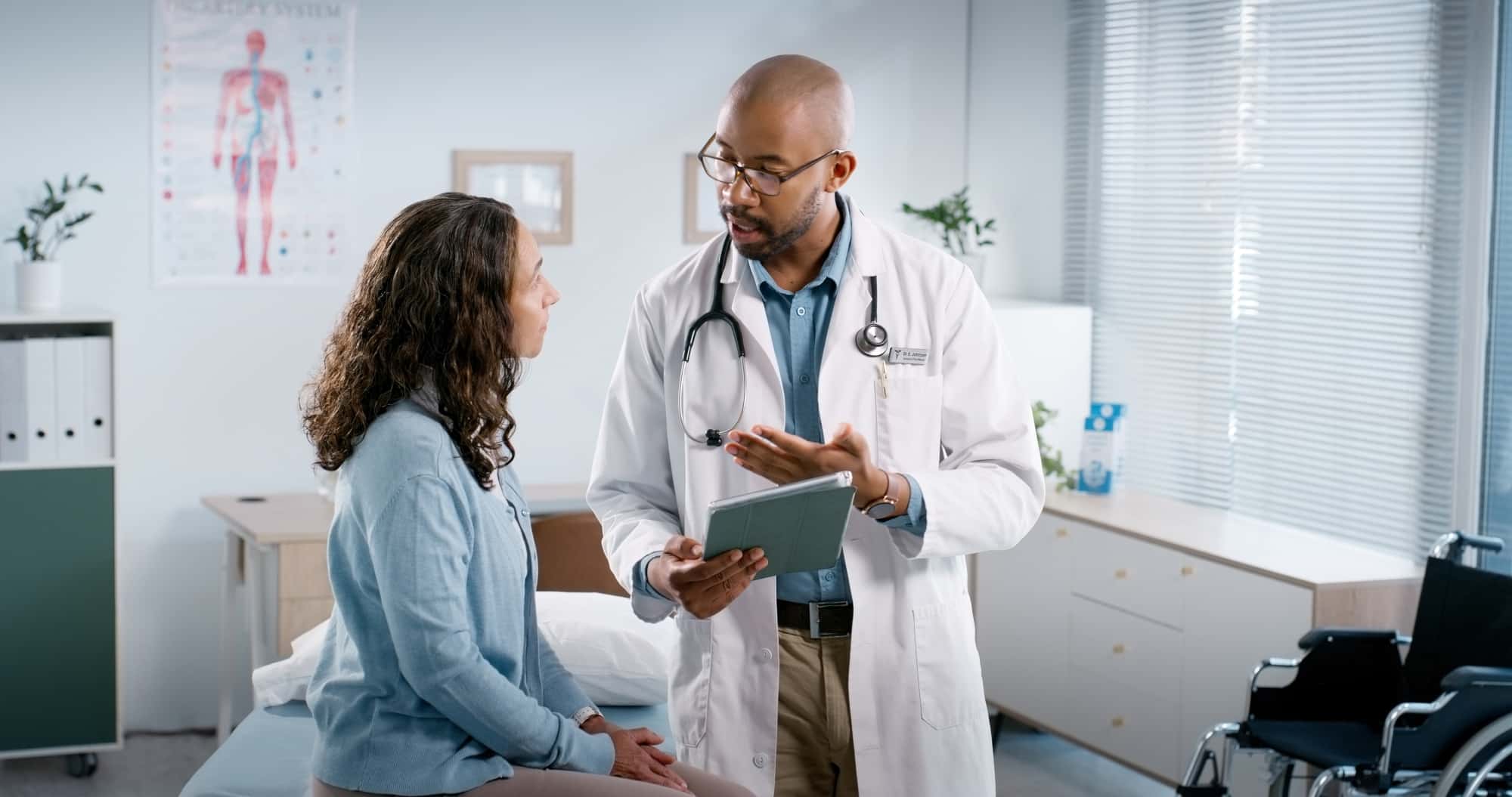 Medicare Advantage A doctor speaks with a patient in their office.