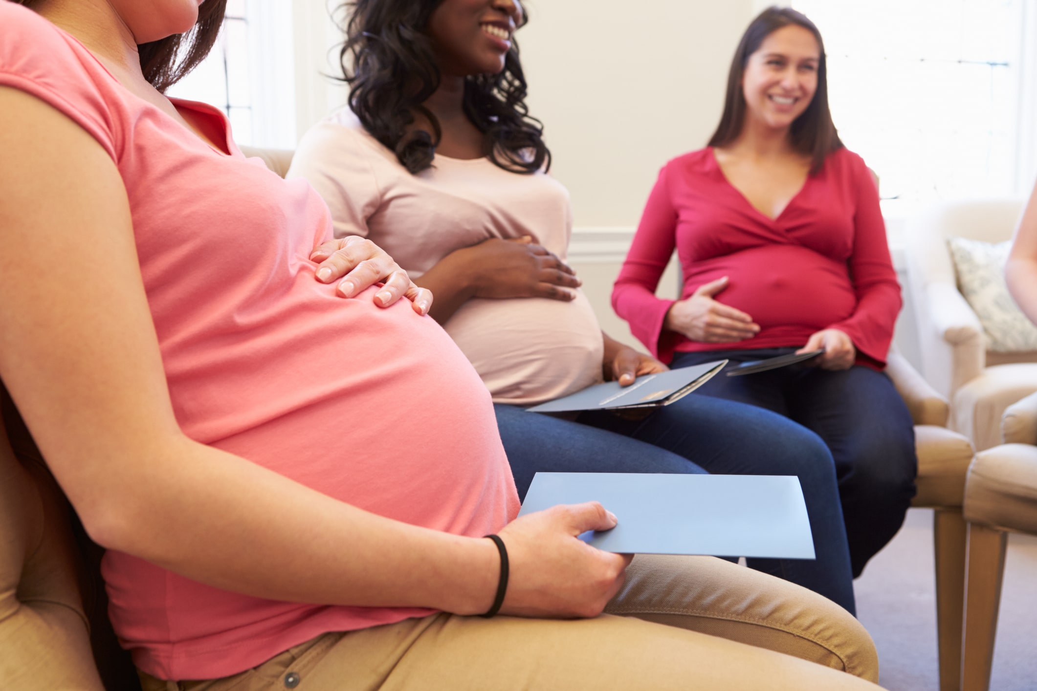 Pregnant women meet at an ante natal class to discuss pregnancy.